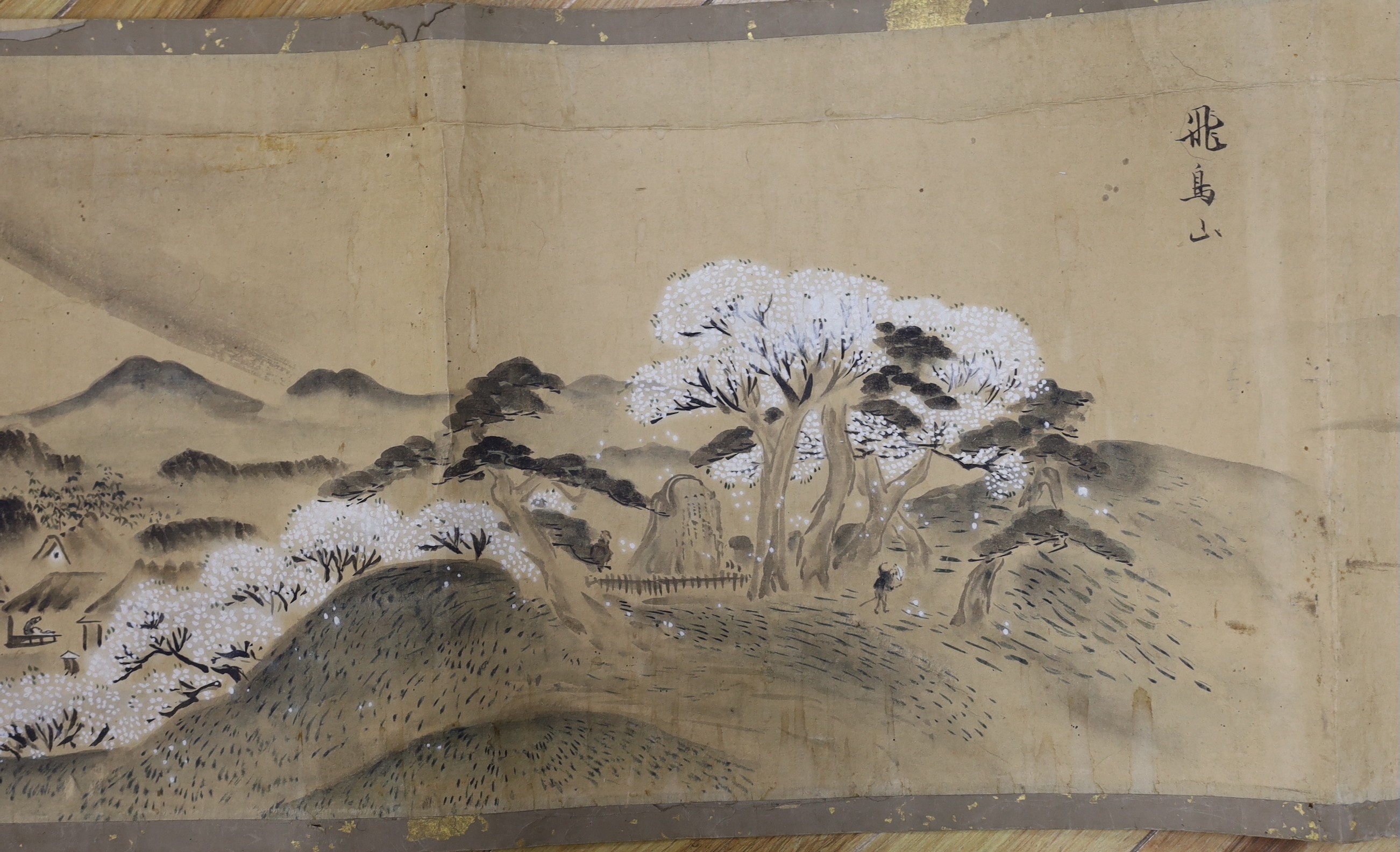 A Japanese landscape painting on paper hand scroll, Edo period, titled views, now in two parts, incomplete, image 27cm high x approximately 470cm wide